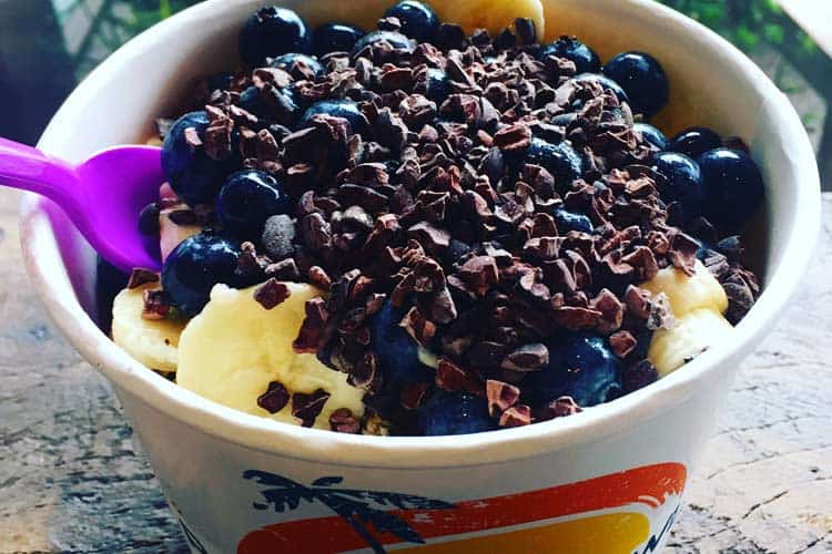 big acai bowl with cacao nibs, blueberries, banana