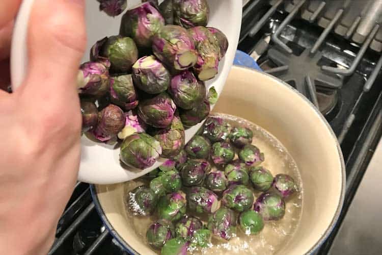 boiling purple Brussels on stove top