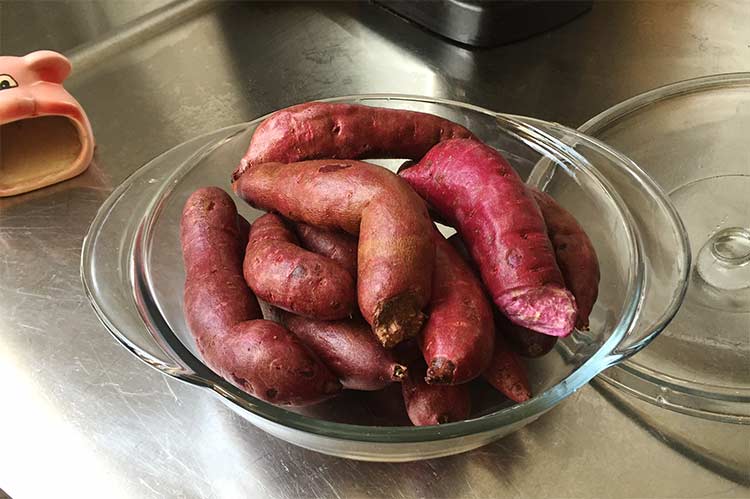 casserole dish of raw purple yams