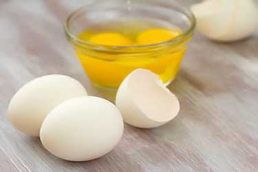 freshly cracked egg shells and yolks