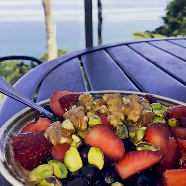 creamed quinoa topped with nuts and berries