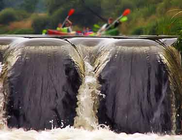 kayaking towards waterfall