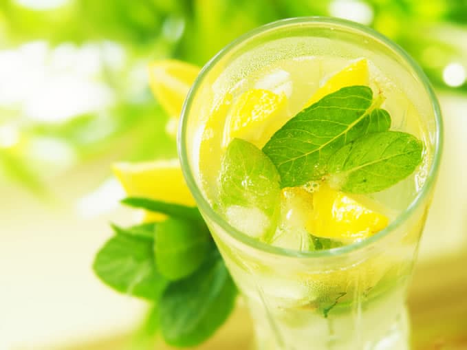 glass of lemon water with mint