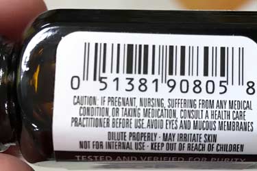 warning label on patchouli oil bottle