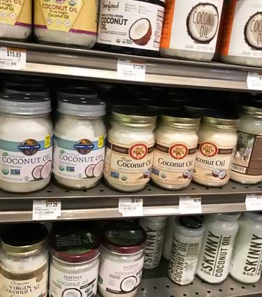 supermarket shelf of coconut oils for sale