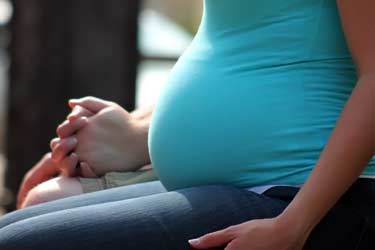 seated pregnant woman