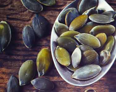 pumpkin seeds on spoon