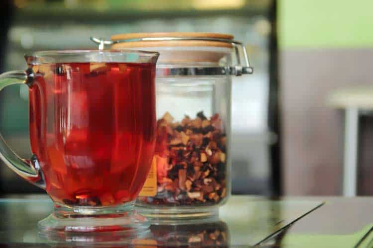 cup of herbal tea high in red anthocyanin antioxidants