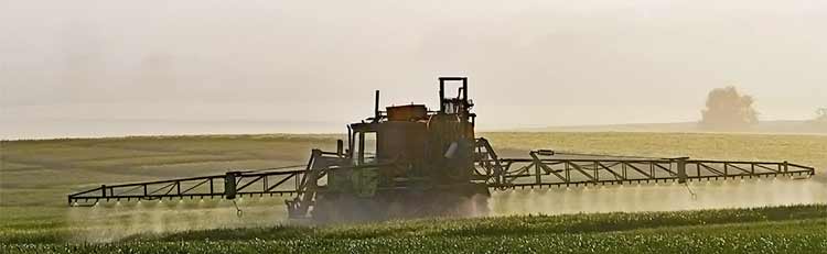 roundup spraying on field by tractor