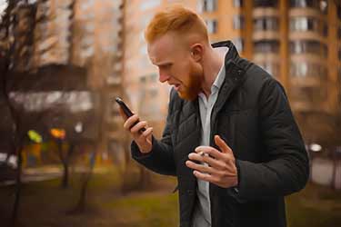 stressed out man yelling on phone