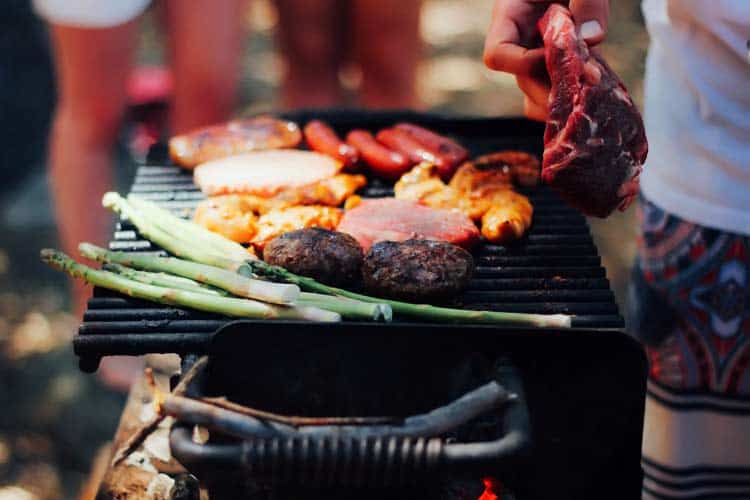 fresh meats and asparagus on BBQ