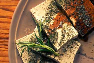 tofu on plate with spices and soy sauce