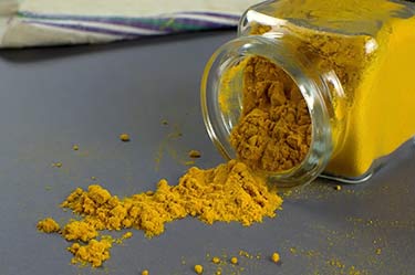 spice bottle of turmeric powder