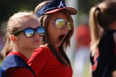 woman yawning at sporting event